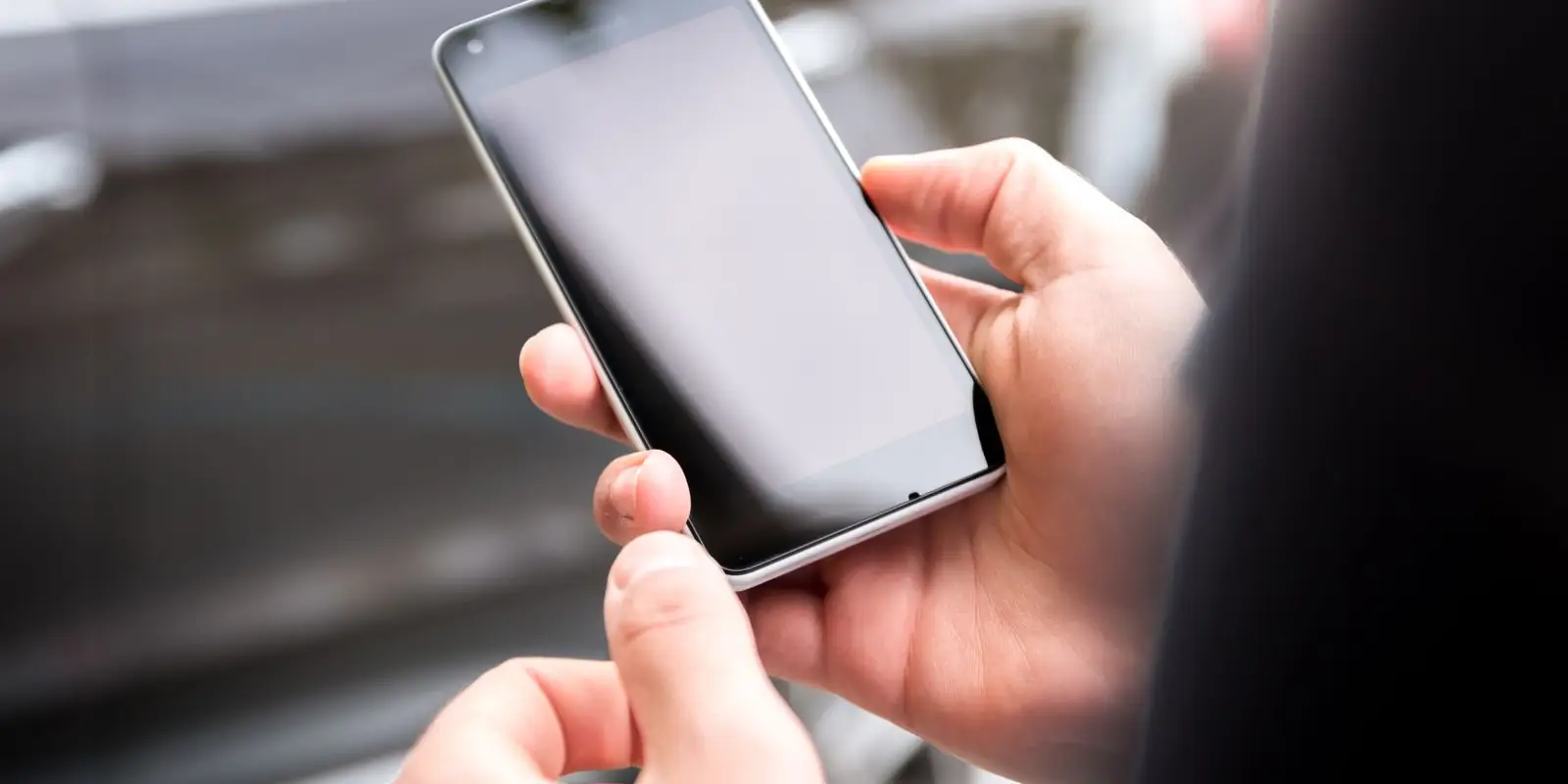 Hands holding a smartphone